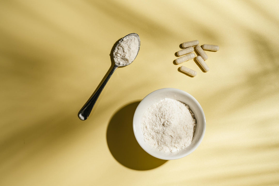 Marine collagen capsules and powder displayed side by side on a neutral surface.
